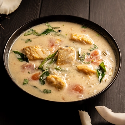 Kerala style meen moilee seafood cooked in coconut milk with mild spices and fresh fish flavors