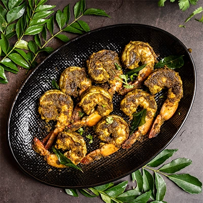 Spicy South Indian prawn varuval pan fried with curry leaves and bold traditional masalas.