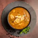 Traditional kozhi milagu saaru soup with rich pepper spice and comforting South Indian flavors