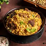 Slow cooked mutton dum biryani layered with fragrant basmati rice and traditional Indian spices