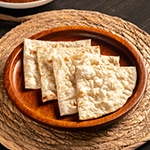 Soft and freshly baked butter naan served warm with rich and flavorful Indian curries.